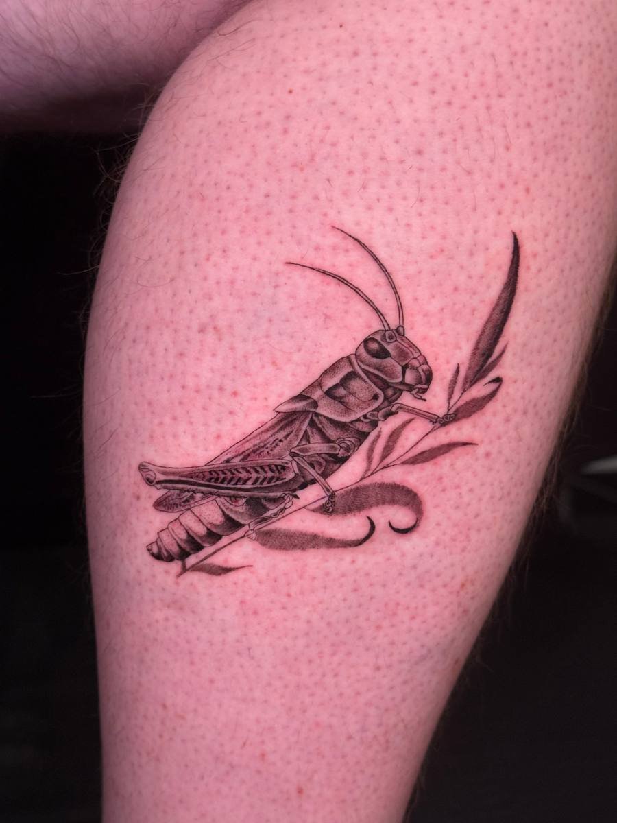 Ornamental amphora vase with flowers and palm leaves tattoo
