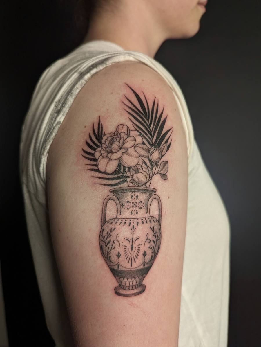 Realistic cardinal on a berry branch tattoo