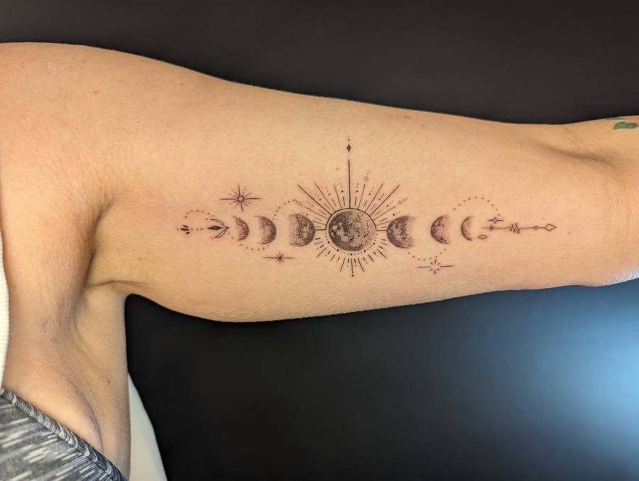 Black and grey grasshopper tattoo